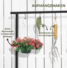 A display of hooks on a rack, with garden tools and a hanging plant pot shown as examples of what can be hung. Produktbild-Vorschau