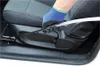 A gloved hand is cleaning the crevice of a car seat with a brush attachment. Produktbild-Vorschau