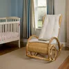 A nursery room with a crib and a rocking chair. Produktbild-Vorschau