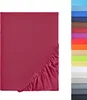 A flat sheet with elasticated corners, shown in a deep pink/red color, with a vertical strip of swatches of other available colors to the right. Produktbild-Vorschau