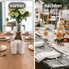 A split image showing a table setting before and after decoration. The left side shows a simple table setting with a vase of white roses. The right side shows a more elaborate table setting with floral arrangements, candles, and glassware. Produktbild-Vorschau