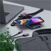 A Satechi Quatro Wireless Power Bank is shown charging an iPhone and an Apple Watch next to a laptop and a bag. Produktbild-Vorschau
