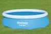 An inflatable pool sits on a grassy lawn. Produktbild-Vorschau