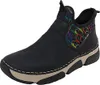 A single black boot with a colorful balloon pattern on the ankle opening, set against a white background. Voir les images du produit