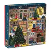 A box of a 500-piece jigsaw puzzle depicting a wintery street scene with buildings, cars, and a Christmas tree. Anteprima dell’immagine prodotto