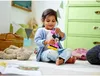 A young girl is playing with a Minnie Mouse toy in a room. Anteprima dell’immagine prodotto