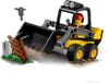 A LEGO City front loader toy with a minifigure driver, demolishing a small structure. Náhľad obrázku produktu
