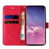 A red flip phone case with floral and butterfly embossing, open to reveal card slots and a banknote, with a Samsung Galaxy S10 phone inserted. Produktbild-Vorschau