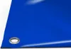 A close-up view of a blue PVC tarp with a metal grommet. Voir les images du produit