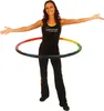 A woman is posing with a hula hoop. Produktbild-Vorschau