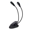 A black clip-on LED reading light with two adjustable gooseneck arms and two LED lights. Voir les images du produit
