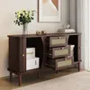 A dark brown sideboard with cane-front drawers and a cabinet, styled with a vase of flowers, decorative spools, and books. Produktbild-Vorschau