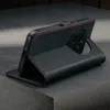 A black leather phone case with red stitching is shown in a studio setting, propped up to display its stand feature. Anteprima dell’immagine prodotto