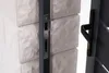 A close-up view of a gate lock mechanism and handle attached to a stone pillar. Produktbild-Vorschau