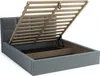 A grey upholstered bed frame with its wooden slatted base lifted to reveal storage space underneath. Produktbild-Vorschau