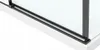 A close-up view of the bottom corner of a shower enclosure, showing the black frame and white base. Podgląd zdjęcia produktu