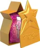 A golden star-shaped box is open, revealing a pink package inside with a silhouette of a doll and a question mark. Voir les images du produit