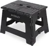 A black folding step stool. Produktbild-Vorschau
