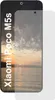 A screen protector is shown on a smartphone displaying a sunset over water. Podgląd zdjęcia produktu