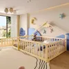 A child's bedroom with a wooden bed frame, toys, and decorative elements. Voir les images du produit