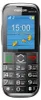 A close-up front view of a black Maxcom MM720 SE mobile phone displaying the time and date on its screen. Podgląd zdjęcia produktu