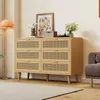 A light wood dresser with rattan-fronted drawers in a room setting. Anteprima dell’immagine prodotto