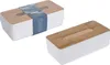 Two tissue boxes with white bases and wooden lids are shown against a white background. One box is in the foreground, and the other is in the background, slightly to the left. Produktbild-Vorschau
