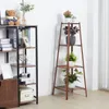 A living room scene with two plant stands displaying various potted plants and decorative items. Produktbild-Vorschau