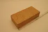 A single brick is placed on a light-colored surface next to a measuring ruler. Podgląd zdjęcia produktu