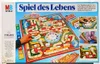 The image shows the box of the board game 'Spiel des Lebens'. The board game itself is visible on the box, along with various game components and illustrations of gameplay. Produktbild-Vorschau