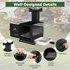 A camping stove with various features highlighted, set against a backdrop of a campsite scene with tents and people. Produktbild-Vorschau