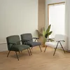 Three armchairs are arranged in a room with a large window and a plant. Produktbild-Vorschau