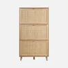 A shoe cabinet with three drawers, made of wood and rattan, standing on four legs. Produktbild-Vorschau