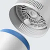 A close-up view of the top part of a white air purifier with a blue band and a fan inside. Náhled obrázku produktu