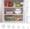 Inside a refrigerator with shelves holding food items and containers. Produktbild-Vorschau