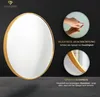 A round mirror with a golden frame is shown, with inset images highlighting features and text describing the product. Produktbild-Vorschau