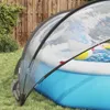 A transparent pool dome covering an inflatable pool in a backyard setting. Voir les images du produit