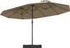 A double patio umbrella with a black base and pole, and tan fabric canopy. Podgląd zdjęcia produktu