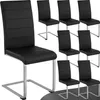 A set of black dining chairs with silver legs arranged on a white background. Náhled obrázku produktu