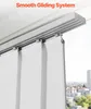 Close-up of a smooth gliding system for vertical blinds, with a city skyline visible in the background. Náhľad obrázku produktu