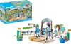A Playmobil Horses of Waterfall playset featuring a modern riding school with figures, horses, and accessories, along with its packaging. Produktbild-Vorschau