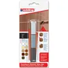 The product is a furniture repair wax kit packaged in a blister pack. The packaging shows the product and provides usage instructions and color swatches. Podgląd zdjęcia produktu