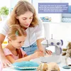 A woman and a child are shown using a small sewing machine. Produktbild-Vorschau