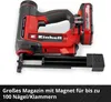 A red and black Einhell cordless nailer with a battery pack attached, shown from a slightly elevated side angle. The magazine with nails is visible at the front. Text describing the product's features is present at the bottom. Produktbild-Vorschau