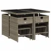 A patio dining set with a glass top table and four stools tucked underneath. Produktbild-Vorschau