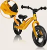A yellow balance bike is shown against a light gray background with a close-up inset of the frame. Produktbild-Vorschau