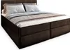 A studio shot of a brown box spring bed with white and gray bedding. Produktbild-Vorschau