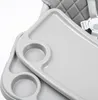 A close-up view of a gray high chair tray with cup holders. Náhľad obrázku produktu