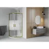 A modern bathroom featuring a gold-framed shower cabin and a floating vanity with a sink. Podgląd zdjęcia produktu