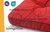 A close-up of a red cushion for garden furniture, highlighting its stitching and frame. Produktbild-Vorschau